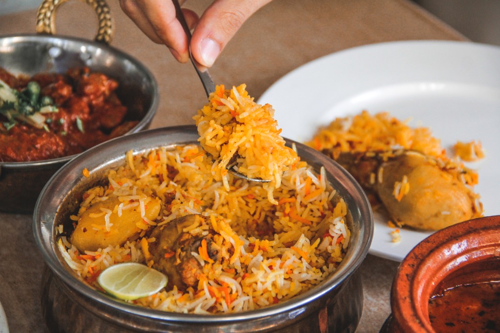 Biryani being served from the pot